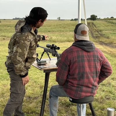 One-on-one field instruction behind a precision rifle