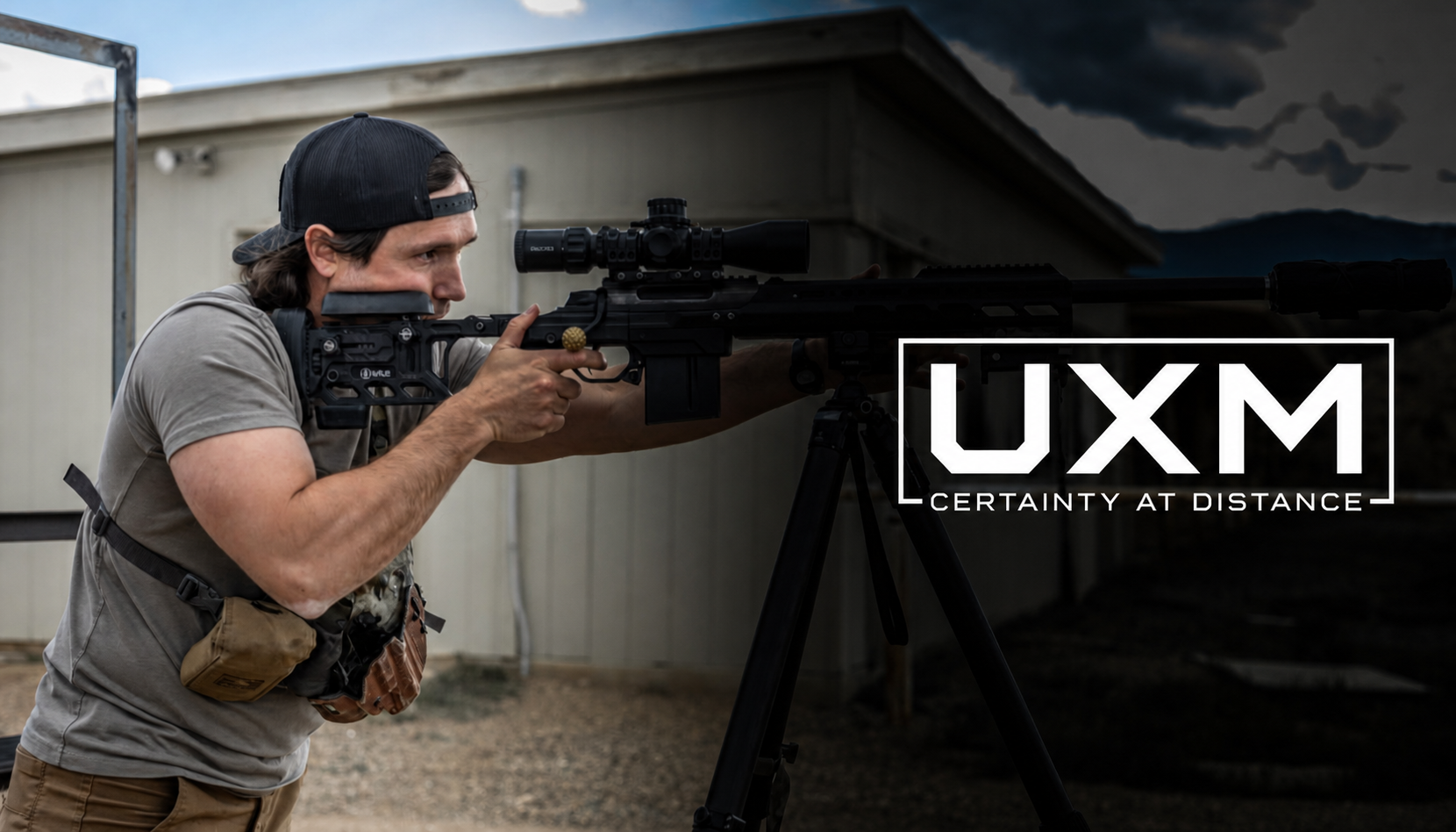 Shooter behind a precision rifle on a tripod